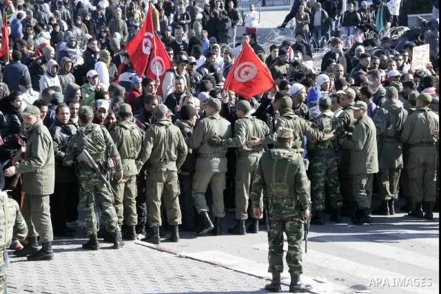 Tunisian protesters gather to demand a new government free of officials of the ousted regime of former president Zine el Abidine Ben Ali, near the Prime Minister's office in Tunis, Tunisia, 24 January 2011. According to...
