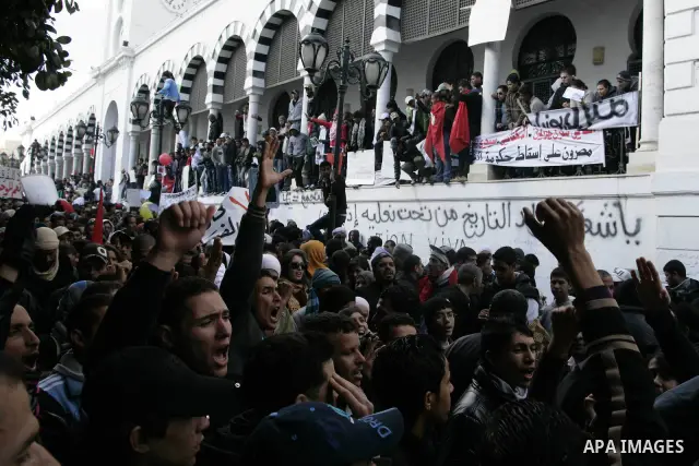 Tunisian protesters gather to demand a new government free of officials of the ousted regime of former president Zine el Abidine Ben Ali, near the Prime Minister's office in Tunis, Tunisia, 24 January 2011. According to...