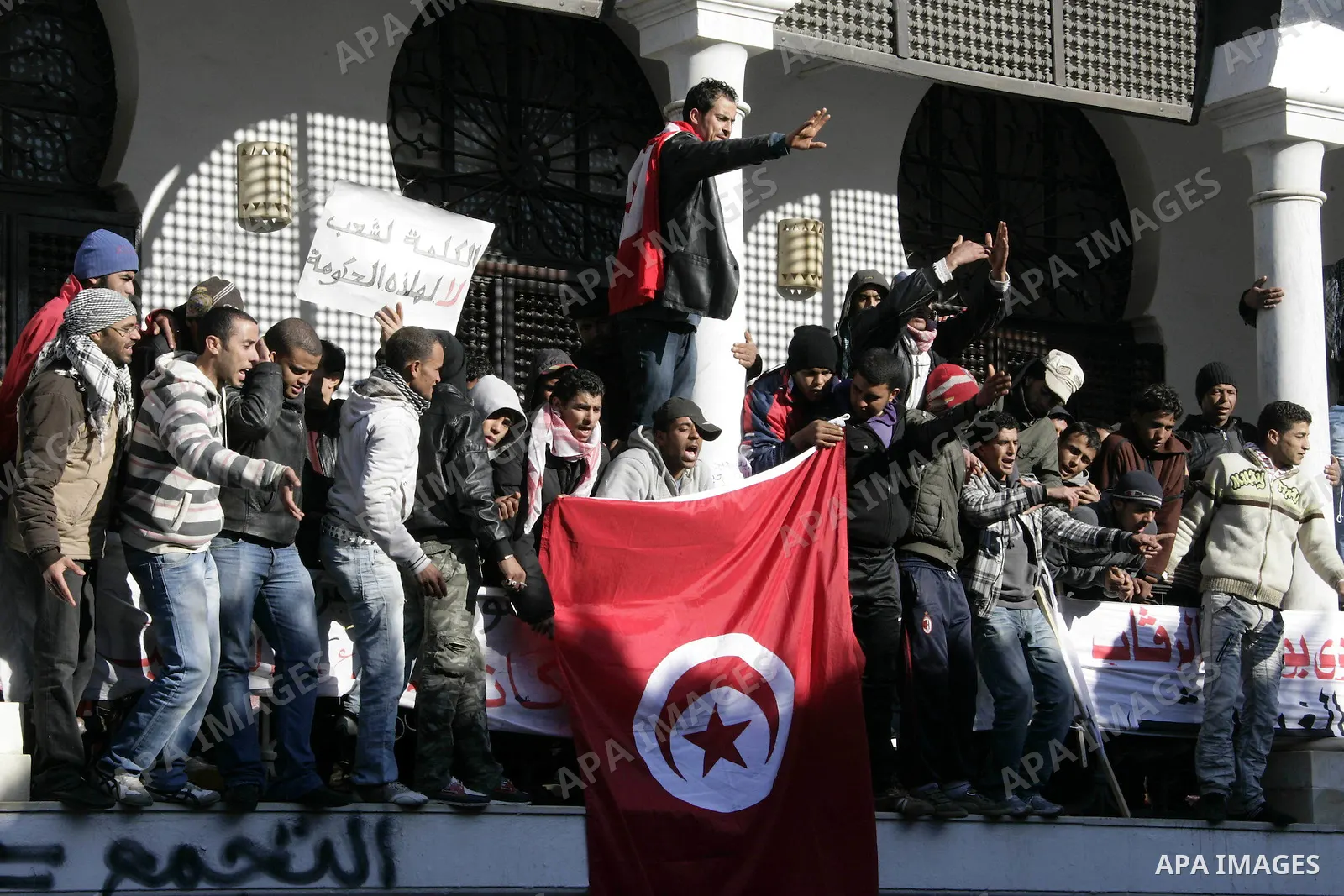 Tunisian protesters gather to demand a new government free of officials of the ousted regime of former president Zine el Abidine Ben Ali, near the Prime Minister's office in Tunis, Tunisia, 24 January 2011. According to...