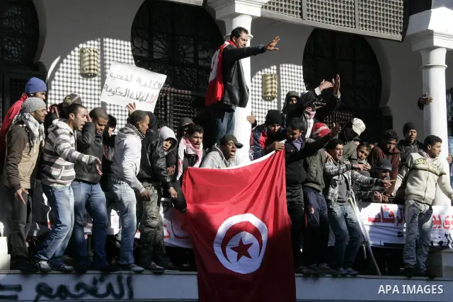 Tunisian protesters gather to demand a new government free of officials of the ousted regime of former president Zine el Abidine Ben Ali, near the Prime Minister's office in Tunis, Tunisia, 24 January 2011. According to...