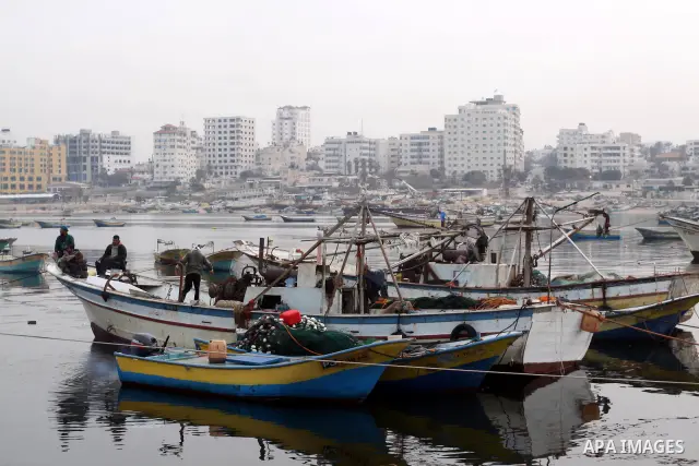 Palestinian fishermen work inside the port of Gaza City on Jan. 25, 2011. Fishermen, suffer from the tightening of the Israeli siege imposed on Palestinian fishermen a forbidden fishermen by Israel to enter the sea for m...