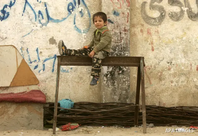 Palestinian children play in alley in the Rafah refugee camp in the southern Gaza Strip on January 25, 2011, a day after it was leaked by Al-Jazeera in revealed documents that Palestinian negotiators accepted Israel's pr...