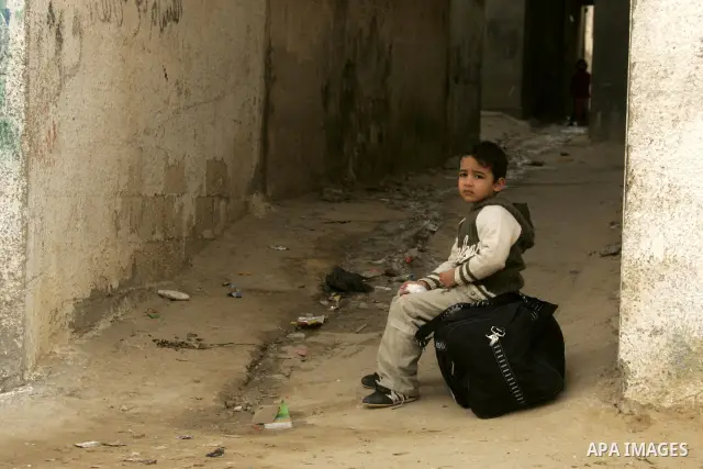 Palestinian children play in alley in the Rafah refugee camp in the southern Gaza Strip on January 25, 2011, a day after it was leaked by Al-Jazeera in revealed documents that Palestinian negotiators accepted Israel's pr...