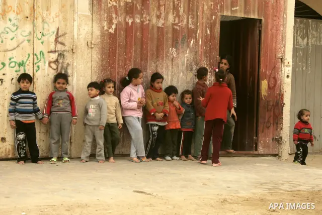 Palestinian children play in alley in the Rafah refugee camp in the southern Gaza Strip on January 25, 2011, a day after it was leaked by Al-Jazeera in revealed documents that Palestinian negotiators accepted Israel's pr...