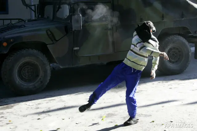 Tunisian policemen fire tear gas canisters at protestors during a demonstration against Prime Minister Mohammed Ghannouchi in front of the government palace in Tunis.Tunisia, 26 January 2011, Hundreds of defiant Tunisian...