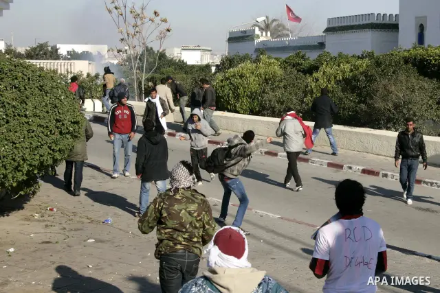 Tunisian policemen fire tear gas canisters at protestors during a demonstration against Prime Minister Mohammed Ghannouchi in front of the government palace in Tunis.Tunisia, 26 January 2011, Hundreds of defiant Tunisian...