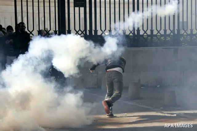 Tunisian policemen fire tear gas canisters at protestors during a demonstration against Prime Minister Mohammed Ghannouchi in front of the government palace in Tunis.Tunisia, 26 January 2011, Hundreds of defiant Tunisian...