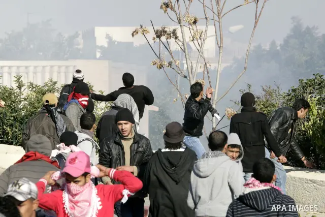 Tunisian policemen fire tear gas canisters at protestors during a demonstration against Prime Minister Mohammed Ghannouchi in front of the government palace in Tunis.Tunisia, 26 January 2011, Hundreds of defiant Tunisian...
