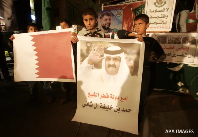 Palestinian Hamas activists take part rally against Abbas, following a recent broadcast by Al-Jazeera reportedly linking him to making broad concessions to Israel in peace talks, in Rafah, southern Gaza Strip, Wednesday,...