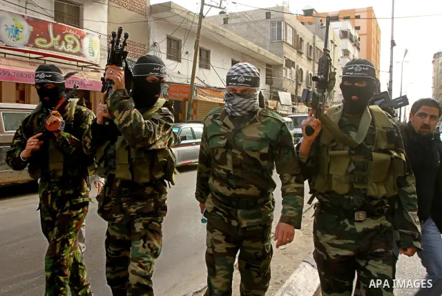 Masked Palestinian militants of a group affiliated with the Al Aqsa Martyrs Brigades attend a press conference in Gaza City, Thursday, Jan. 27, 2011. Members of the tiny offshoot of the now largely defunct militant group...