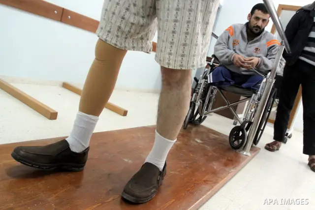 Palestinian victims of Gaza 2008/2009 war test out their new prosthetic legs during the opening of a new prosthetics and paralysis center in coordination between the International Committee of Red Cross and the Municipal...