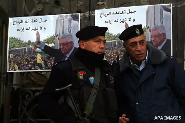 Palestinian Police on guard at the entrance of the Al-Jazeera office in the West Bank town of Ramallah on 27 January 2011. Al-Jazeera, a Qatar-based Arab satellite station, this week published excerpts from what it said...
