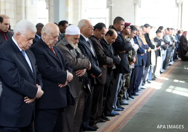 Palestinian President Mahmoud Abbas attends Friday prayers at Jamal Abdel Nasser mosque in the West Bank city of Ramallah on Jan. 28,2011. photo by Omar Rashidi