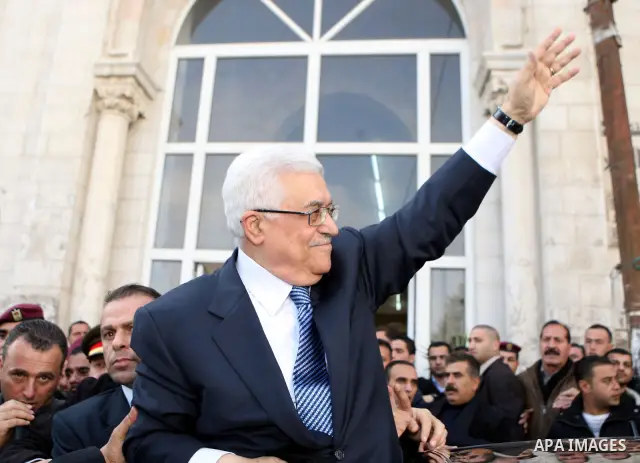 Palestinian President Mahmoud Abbas attends Friday prayers at Jamal Abdel Nasser mosque in the West Bank city of Ramallah on Jan. 28,2011. photo by Omar Rashidi