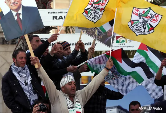 Palestinian Fatah supporters take part in a rally in support of Palestinian President Mahmoud Abbas and against the Al-Jazeera TV station in the West Bank city of Ramallah, Friday, Jan. 28, 2011. The Qatar-based Arab sat...