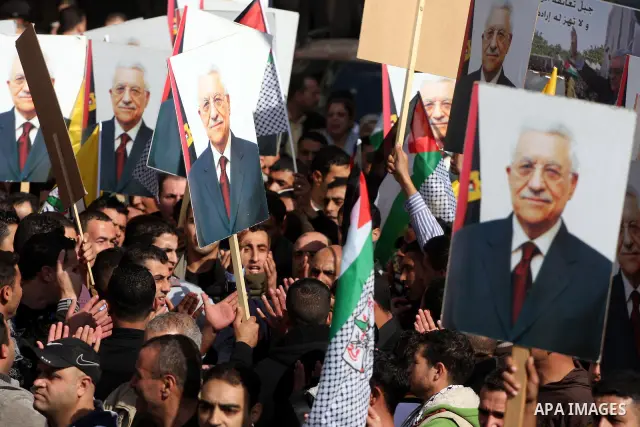 Palestinian Fatah supporters take part in a rally in support of Palestinian President Mahmoud Abbas and against the Al-Jazeera TV station in the West Bank city of Ramallah, Friday, Jan. 28, 2011. The Qatar-based Arab sat...