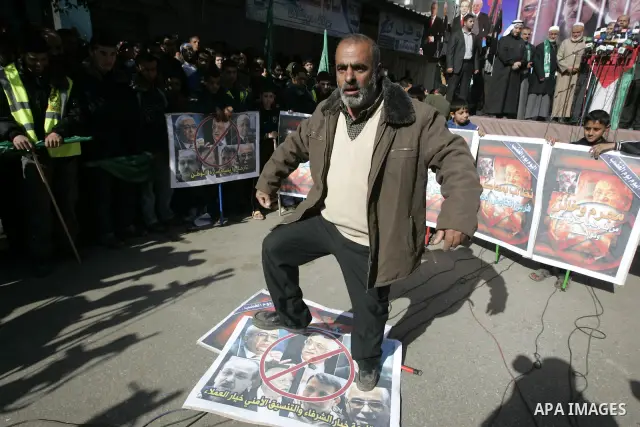 Palestinian Hamas activists protest against Palestinian President Mahmoud Abbas and his government following a recent broadcast by Al-Jazeera reportedly linking him to making broad concessions to Israel in peace talks, i...