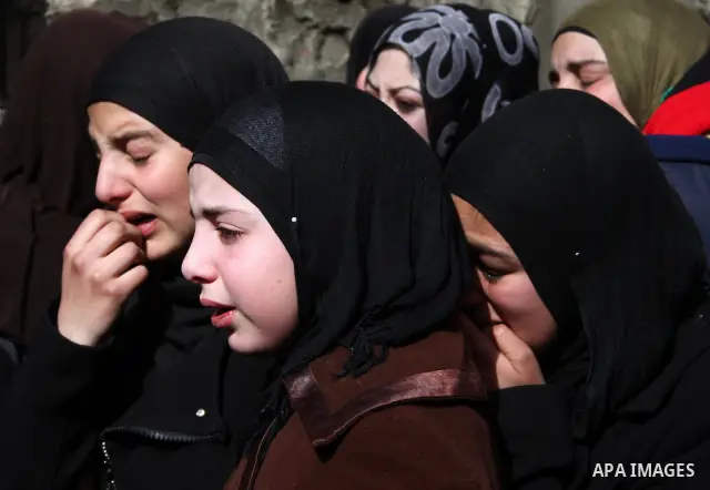 Palestinian women mourn during the funeral of Youssef Ekhaleil in the West Bank village of Beit Omar, near Hebron, Saturday, Jan. 29, 2011. Ekhaleil died from wounds sustained during a clash with settlers on Friday Photo...