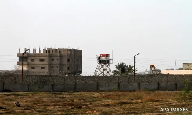 An Egyptian soldier stands guard on a control tower in the border with the Gaza Strip in the city of Rafah, southern Gaza Strip on, 29 January 2011. The embattled Mubarak tapped Egypt's military intelligence chief as his...