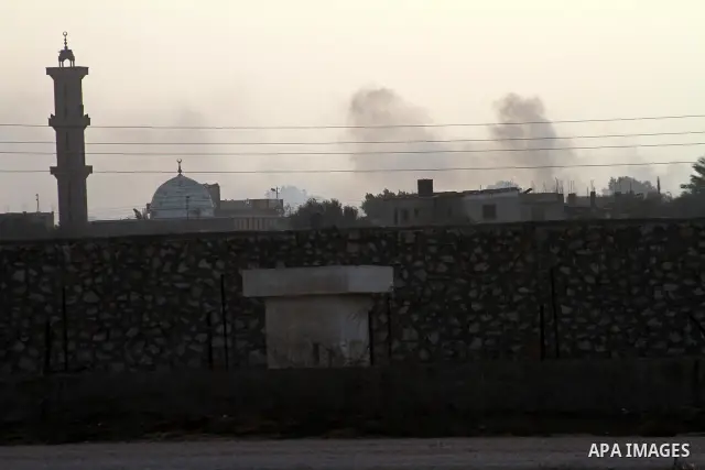 A cloud of smoke is seen near the Egyptian border with the Gaza Strip in the city of Rafah, southern Gaza Strip on, 29 January 2011. The embattled Mubarak tapped Egypt's military intelligence chief as his first-ever vice...