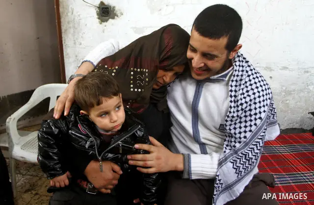 Hassan Weshah a political prisoner arrives to his home after he fled from the prison of Abu Zaabal in Egypt, in the Bureij refugee camp , Sunday, Jan. 30 , 2011. Photo by Ashraf Amra