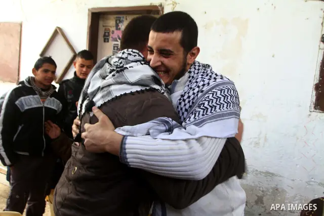 Hassan Weshah a political prisoner arrives to his home after he fled from the prison of Abu Zaabal in Egypt, in the Bureij refugee camp , Sunday, Jan. 30 , 2011. Photo by Ashraf Amra