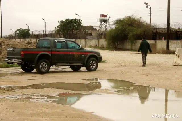 Members of Hamas's security forces stand guard at the Palestinian side of the border in the southern Gaza in the city of Rafah, southern Gaza Strip on January, 30, 2011. at least two of the prisoners who had been held in...