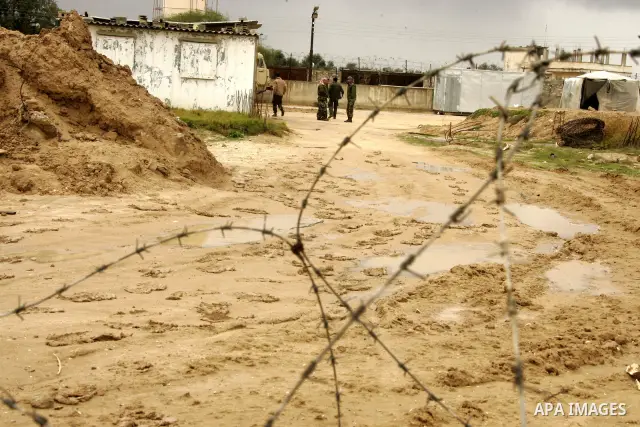 Members of Hamas's security forces stand guard at the Palestinian side of the border in the southern Gaza in the city of Rafah, southern Gaza Strip on January, 30, 2011. at least two of the prisoners who had been held in...