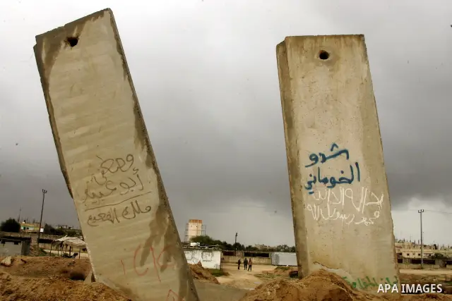 Members of Hamas's security forces stand guard at the Palestinian side of the border in the southern Gaza in the city of Rafah, southern Gaza Strip on January, 30, 2011. at least two of the prisoners who had been held in...
