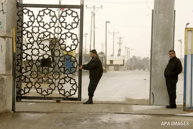 Members of Hamas's security forces stand guard at the Palestinian side of the border in the southern Gaza in the city of Rafah, southern Gaza Strip on January, 30, 2011. at least two of the prisoners who had been held in...