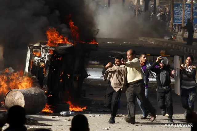 Egyptian policemen are arrested by demonstrators during an anti-government protest in Cairo, capital of Egypt, on Friday, Jan. 28, 2011. Photo by Karam Nasser