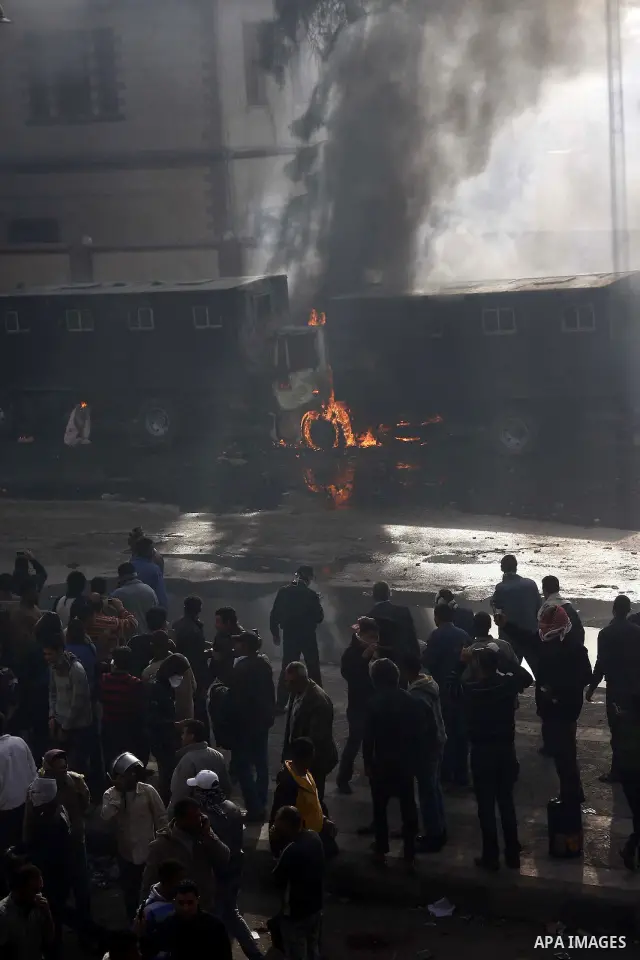 Police vehicles are set on fire by anti-government demonstrators in Cairo, capital of Egypt, on Friday, Jan. 28, 2011. Photo by Karam Nasser