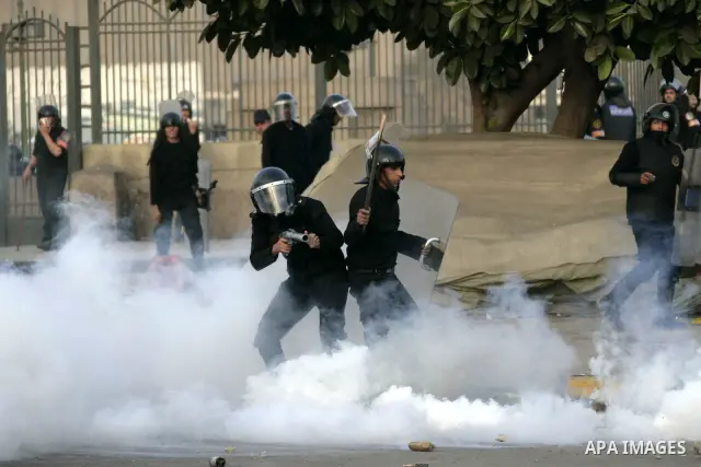 Egyptian policemen fire tear gas canisters towards demonstrators during a protest in Cairo, Egypt, Friday, Jan. 28, 2011. Photo by Karam Nasser