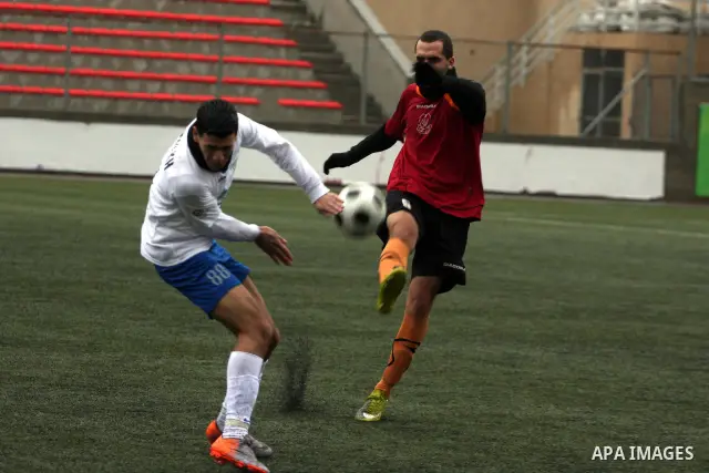 Palestinians play a football match between Tulkarem Cultural club and Balata Camp club in the occupied West Bank on Feb. 1,2011. Photo by Issam Rimawi
