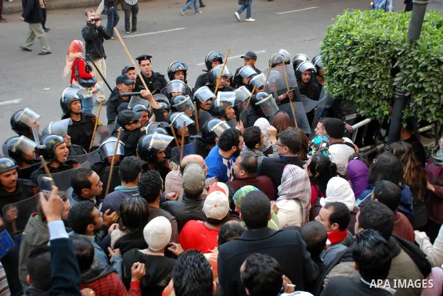 Anti-government protesters scuffle with Egyptian policemen in Tahrir, or Liberation Square in Cairo, Egypt, Jan. 27, 2011. Photo by Ahmed Asad