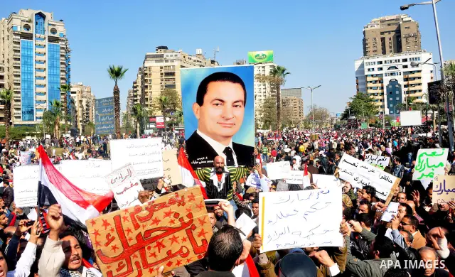 Supporters of President Hosni Mubarak takes part in a protest in Cairo, Egypt, Wednesday, Feb. 2, 2011. Several thousand supporters of President Hosni Mubarak, including some riding horses and camels and wielding whips,...