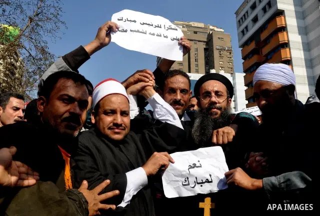 Supporters of President Hosni Mubarak takes part in a protest in Cairo, Egypt, Wednesday, Feb. 2, 2011. Several thousand supporters of President Hosni Mubarak, including some riding horses and camels and wielding whips,...