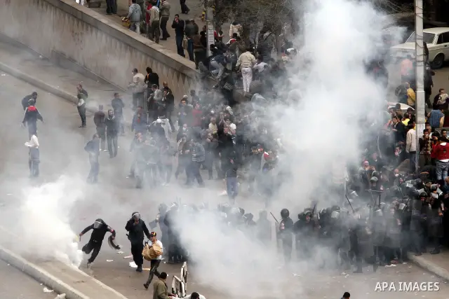 Egyptian policemen fire tear gas canisters towards anti-government protesters during a demonstration against president Hosni Mubarak regime in Tahrir, or Liberation Square in Cairo, Egypt, Jan. 29, 2011. Photo by Karam N...