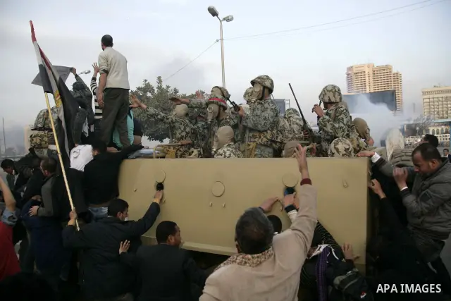 Egyptian policemen fire tear gas canisters towards anti-government protesters during a demonstration against president Hosni Mubarak regime in Tahrir, or Liberation Square in Cairo, Egypt, Jan. 29, 2011. Photo by Karam N...