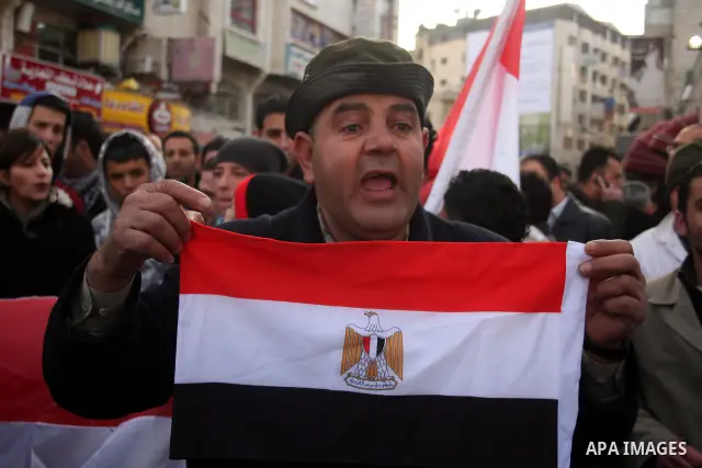 Palestinian supporters of Egyptian President Hosni Mubarak takes part in a protest in the West Bank city of Ramallah, Wednesday, Feb. 2, 2011. Photo by Issam Rimawi