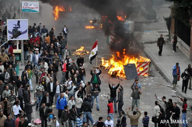 Anti-government demonstrators march in Alexandria, Egypt, Jan. 28. 2011. Egyptian President Hosni Mubarak defied a quarter-million protesters demanding he step down immediately, announcing he would serve out the last mon...