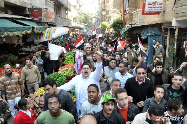 Anti-government demonstrators take part in a protest in Alexandria, Egypt, Jan. 25, 2011. Egyptian President Hosni Mubarak defied a quarter-million protesters demanding he step down immediately, announcing he would serve...