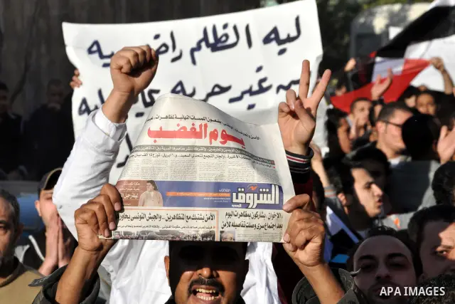 Anti-government demonstrators take part in a protest in Alexandria, Egypt, Jan. 25, 2011. Egyptian President Hosni Mubarak defied a quarter-million protesters demanding he step down immediately, announcing he would serve...