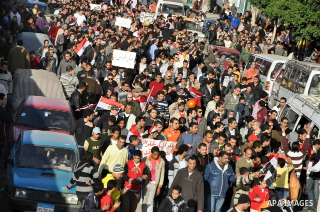 Anti-government demonstrators take part in a protest in Alexandria, Egypt, Jan. 25, 2011. Egyptian President Hosni Mubarak defied a quarter-million protesters demanding he step down immediately, announcing he would serve...