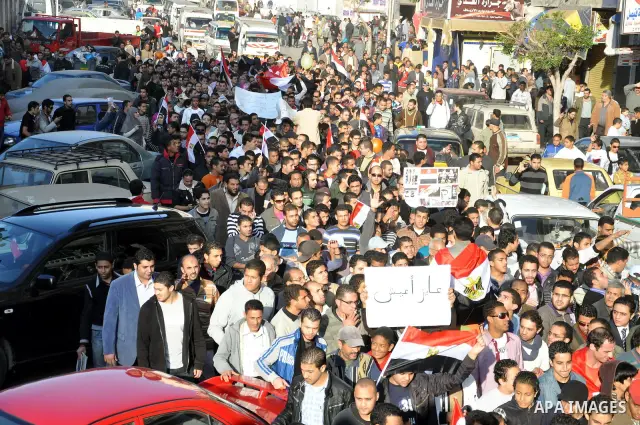Anti-government demonstrators take part in a protest in Alexandria, Egypt, Jan. 25, 2011. Egyptian President Hosni Mubarak defied a quarter-million protesters demanding he step down immediately, announcing he would serve...