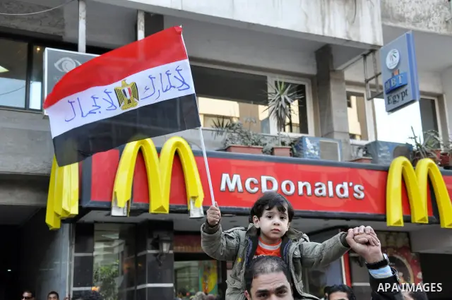 Anti-government demonstrators take part in a protest in Alexandria, Egypt, Jan. 25, 2011. Egyptian President Hosni Mubarak defied a quarter-million protesters demanding he step down immediately, announcing he would serve...