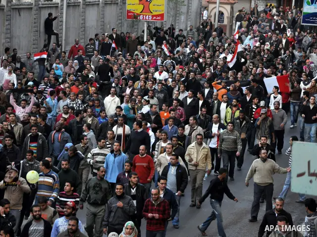 Anti-government demonstrators take part in a protest in Alexandria, Egypt, Jan. 25, 2011. Egyptian President Hosni Mubarak defied a quarter-million protesters demanding he step down immediately, announcing he would serve...