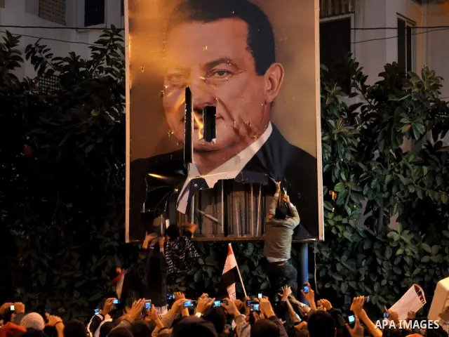 Anti-government demonstrators take part in a protest in Alexandria, Egypt, Jan. 25, 2011. Egyptian President Hosni Mubarak defied a quarter-million protesters demanding he step down immediately, announcing he would serve...