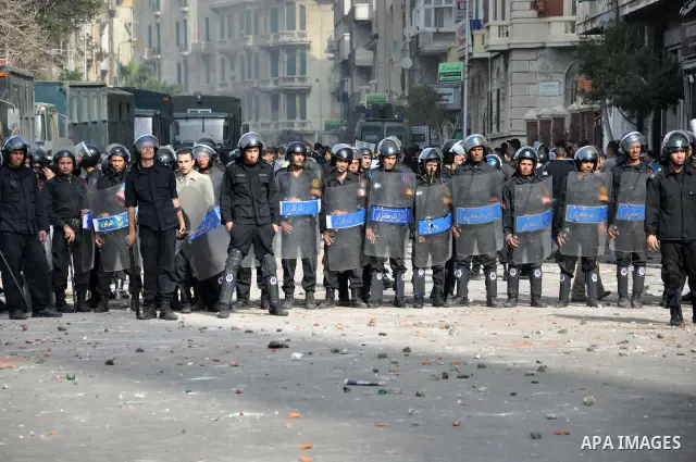 Egyptian police stand guard during fresh demonstrations that erupted following Friday prayers in Alexandria, Egypt, Jan. 28, 2011. Violent clashes marked a 'Friday of rage' in Egypt, as anti-government protesters sought...