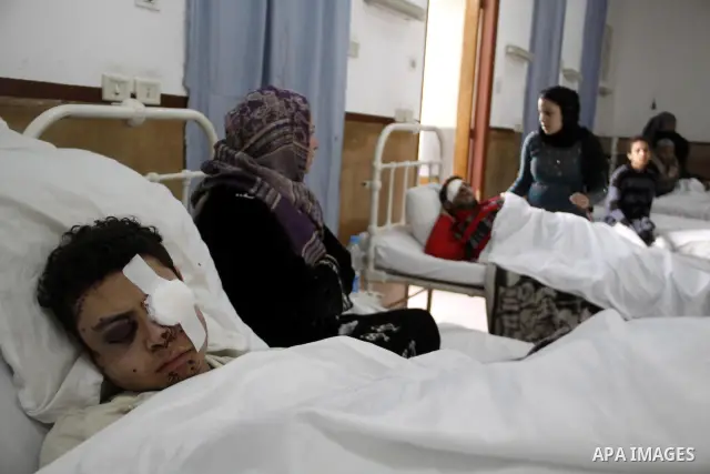 A wounded protester is being treated after being injured during clashes in Cairo's main square, Egypt, Thursday, Feb. 3, 2011. Egyptian army tanks and soldiers moved to end violence between anti-government protesters and...
